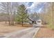 Charming one-story home with a long driveway and a well-maintained front yard at 5833 Westerling Pl, Powder Springs, GA 30127
