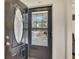 Inviting entryway with glass paneled door and decorative wreath at 5833 Westerling Pl, Powder Springs, GA 30127
