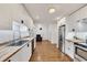 Modern kitchen featuring white cabinets, butcher block countertops and stainless steel appliances at 5833 Westerling Pl, Powder Springs, GA 30127