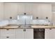 Close-up of kitchen showcasing stainless steel sink, geometric backsplash, and butcher block countertops at 5833 Westerling Pl, Powder Springs, GA 30127