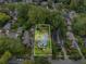 Bird's-eye view of a home with property lines, surrounded by trees and neighboring houses at 645 Cumberland Rd, Atlanta, GA 30306