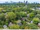 Scenic aerial view of a home nestled amongst lush greenery with the Atlanta skyline in the background at 645 Cumberland Rd, Atlanta, GA 30306