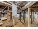 Unfinished basement featuring exposed beams and ductwork and a concrete floor at 645 Cumberland Rd, Atlanta, GA 30306