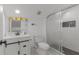 Bright bathroom features a modern vanity, floral decor, and walk-in shower with decorative tiling at 645 Cumberland Rd, Atlanta, GA 30306