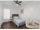 Bedroom featuring a twin bed, hardwood floors, and natural light from the large window at 645 Cumberland Rd, Atlanta, GA 30306