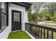 Charming front porch features artificial turf and a view of the neighborhood at 645 Cumberland Rd, Atlanta, GA 30306