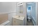 Clean bathroom with a vanity, toilet, and shower/tub combo at 773 Cone Rd, Forest Park, GA 30297