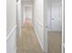 An interior hallway featuring neutral colored walls and carpet flooring at 773 Cone Rd, Forest Park, GA 30297