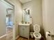 Powder room with modern vanity and wood floors at 91 Reynoldston Ct, Suwanee, GA 30024