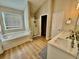 Bright bathroom with double vanity, soaking tub and shower at 91 Reynoldston Ct, Suwanee, GA 30024