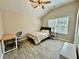 Cozy bedroom with vaulted ceiling, ceiling fan, desk, and wood-look flooring at 91 Reynoldston Ct, Suwanee, GA 30024