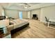 Spacious main bedroom with ceiling fan, wood floors and lots of space at 91 Reynoldston Ct, Suwanee, GA 30024