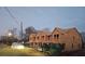 Unfinished townhomes showcasing exterior framing under a dusk sky, signaling new construction at 11602 E Lovejoy Rd, Hampton, GA 30228