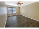 Inviting bedroom with hardwood floors, a ceiling fan, and a large window at 2064 Powers Ferry Se Trce, Marietta, GA 30067