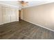 Bedroom with hardwood floors, a ceiling fan, and a spacious closet at 2064 Powers Ferry Se Trce, Marietta, GA 30067