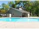 Community pool area with a bath house and well-maintained pool at 2064 Powers Ferry Se Trce, Marietta, GA 30067