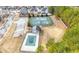 Aerial view of community pool and tennis courts, surrounded by trees at 2268 Austin Common Way, Dacula, GA 30019