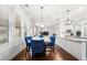 Dining room with a marble table, blue velvet chairs, and wood floors at 2268 Austin Common Way, Dacula, GA 30019