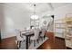 Dining room with hardwood floors, coffered ceilings, and easy access to the hallway and other rooms at 2268 Austin Common Way, Dacula, GA 30019