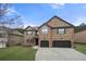 Beautiful brick home featuring a two-car garage and manicured lawn at 2268 Austin Common Way, Dacula, GA 30019