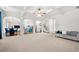 Bright and airy living room with coffered ceiling, open to kitchen and dining area at 2268 Austin Common Way, Dacula, GA 30019