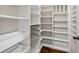 Pantry with white shelving, storage drawers, and ample space for kitchen essentials and supplies at 2268 Austin Common Way, Dacula, GA 30019