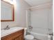 Bright bathroom featuring a vanity, a toilet, and a shower-tub combo at 4676 Cedar Park Trl, Stone Mountain, GA 30083