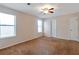 Bedroom featuring plush carpet, bright windows, and a ceiling fan at 4676 Cedar Park Trl, Stone Mountain, GA 30083