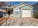 Charming home features light green siding and a one car garage at 4676 Cedar Park Trl, Stone Mountain, GA 30083