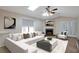 Staged living room with a fireplace and a large window at 4676 Cedar Park Trl, Stone Mountain, GA 30083