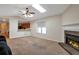 Living room with a skylight, fireplace and neutral carpet at 4676 Cedar Park Trl, Stone Mountain, GA 30083