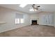 A relaxing living space with a ceiling fan and cozy fireplace at 4676 Cedar Park Trl, Stone Mountain, GA 30083