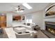 Staged living room with a skylight, fireplace, and neutral carpet at 4676 Cedar Park Trl, Stone Mountain, GA 30083