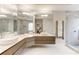 Bright bathroom featuring double sinks and a glass shower at 5964 Reddington Way, Sandy Springs, GA 30328