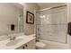 Bathroom featuring a single sink vanity and a tub shower with sliding glass doors at 5964 Reddington Way, Sandy Springs, GA 30328