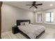 This bedroom features a ceiling fan, neutral walls, and two large windows providing great natural light at 5964 Reddington Way, Sandy Springs, GA 30328