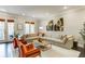 Bright living room features a sectional sofa, comfortable seating, and a stylish rug, creating an inviting space at 5964 Reddington Way, Sandy Springs, GA 30328