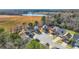 An aerial view of new-construction homes in a peaceful cul-de-sac community with a pond at 11997 Lovejoy Crossing Way, Hampton, GA 30228