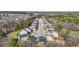 An aerial view of new-construction homes in a peaceful community surrounded by trees at 11997 Lovejoy Crossing Way, Hampton, GA 30228