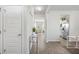 Inviting entryway featuring hardwood floors, neutral walls, and plenty of natural light, creating a welcoming ambiance at 11997 Lovejoy Crossing Way, Hampton, GA 30228