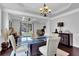 Bright dining room with a glass table, a chandelier, and views to the front yard at 48 Scenic Ovlk, Acworth, GA 30101