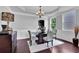 Elegant dining room with modern decor, a tray ceiling, and large windows for natural light at 48 Scenic Ovlk, Acworth, GA 30101