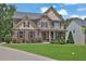 Charming two-story home with a combination brick and stone facade and well-manicured lawn at 48 Scenic Ovlk, Acworth, GA 30101