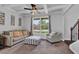 Cozy living room featuring a coffered ceiling, plush furniture, and view of the outdoor landscape at 48 Scenic Ovlk, Acworth, GA 30101