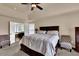 Spacious primary bedroom with neutral tones, a king-size bed, and sitting area at 48 Scenic Ovlk, Acworth, GA 30101