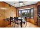 Cozy breakfast nook with wood paneling and a window overlooking the backyard at 1605 Saint Tropez Way, Atlanta, GA 30350