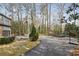 Circular driveway leading to home with beautiful yard, basketball court and trampoline at 1605 Saint Tropez Way, Atlanta, GA 30350