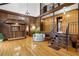 Great room featuring wood paneling, open staircase and second story with wrought iron railing at 1605 Saint Tropez Way, Atlanta, GA 30350