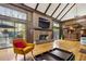 Inviting living room with a brick fireplace, hardwood floors, vaulted ceiling, and natural light at 1605 Saint Tropez Way, Atlanta, GA 30350