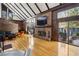 Inviting living room with a brick fireplace, hardwood floors, vaulted ceiling, and natural light at 1605 Saint Tropez Way, Atlanta, GA 30350